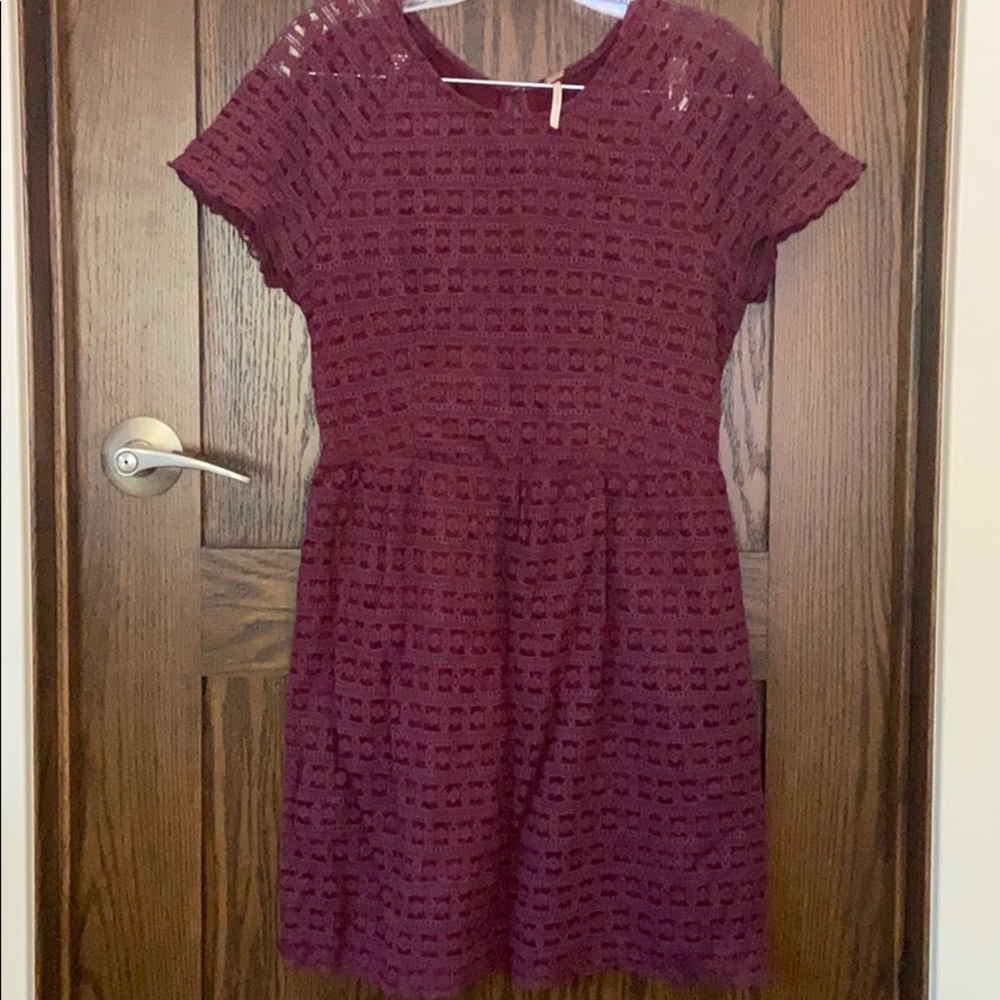 Lace dress with a small tear on left sleeve
